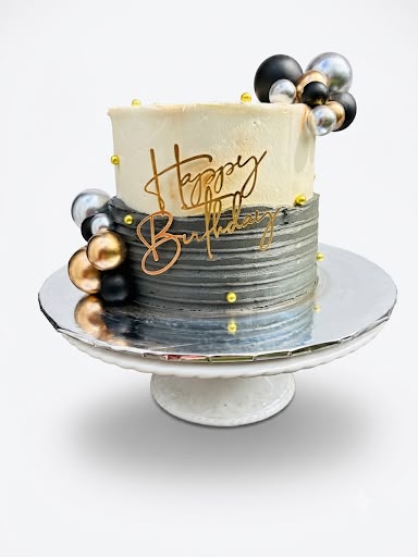Black and gold celebration cake